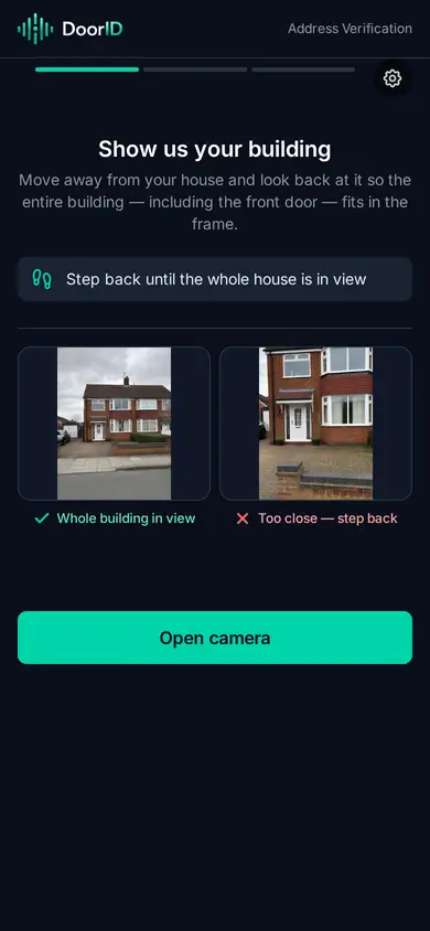 The DoorID coaching screen at the address, showing the customer what to photograph and how to stand back from the building.
